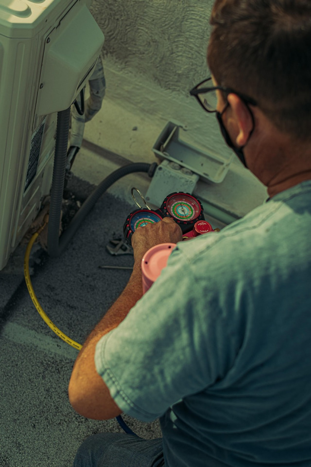 technician fixing appliance